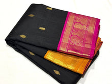 Vaibhogam-Gorgeous Black with Mustard and Rani Pink Ganga Jamuna borders Handwoven Pure Jari Korvai Kanjivaram Silk with Buttas woven beautiful body rich borders pallu and contrast blouse. A stunner for this wedding season !