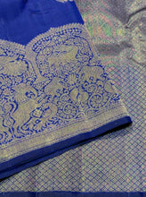 Vaibhogam- Stunning Royal Blue with Gold Handwoven Pure 2g Jari Kanjivaram Silk with beautiful peacocks and iruthalaipakshi motits woven body with beautiful turning borders with gorgeous weaving rich pallu and buttas woven blouse