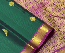 Sahana- Gorgeous Deep Forest Green with Dark Magenta Handwoven Pure Jari Kanjivaram Silk with Muthukattam with Mayil Kuyil Bird buttas woven beautiful body with small borders rich 1000 buttas style woven pallu and contrast woven blouse