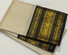 Vaibhogam- Beautiful Offwhite with Black Handwoven Pure2g Jari Korvai Kanjivaram Silk with beautiful striped body with rich borders stunning rich seer pallu and contrast woven beautiful black blouse