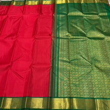 Sarasangi- Gorgeous Red with Emerald Green Handwoven Pure Jari Korvai Kanjivaram Silk with beautiful gandaberundas woven borders with rich 1000 buttas pallu and contrast emerald green blouse beauty