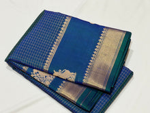 Sahana- Beautiful Peacock Blue with Gold and Green selvedges Handwoven Pure Jari Kanjivaram Silk with beautiful yazhis and gandaberunds woven both side borders kottadi jari checks woven body rich pallu and self colored blouse