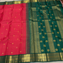 Vaibhogam- Gorgeous Tomato Red with Deep Emerald Green Handwoven Pure 2g Jari Korvai with Buttas Kanjivaram Silk with beautiful borders rich pallu and contrast woven blouse