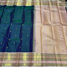 Deep Prussian Blue (dual tone of sapphire blue and green) with Soft Pink Buttas Handwoven Pure Jari Korvai Kanjivaram Silk Saree with rich meenakari varisaipet borders with vel, annam, manga, Neli streaks woven rich borders rich pallu and contrast woven