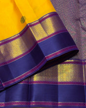 Vaibhogam- Gorgeous Yellow with Blue Handwoven Pure 2gJari Korvai Kanjivaram Silk with beautiful gandaberundas woven silk buttas in body with beautiful spaced meenakari woven borders rich pallu and contrast woven blouse