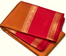 Sahana- Gorgeous Double tone Golden Mustard Shot color body with red combo in a beautiful handwoven pure Kanjivaram Silk with thilagam buttas woven with beautiful rettapet borders gorgeous simhayazhi motif woven pallu with a contrast woven red blouse