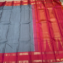 Gorgeous Handwoven Pure Jari Korvai Kanjivaram Silk Saree with greyish blue and dark grey striped body with gorgeous dual tone kanakambaram orange pink rettapet rudrakshas woven borders rich temple rekku pallu and contrast woven blouse