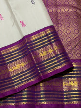 Vaibhogam- Gorgeous Offwhite with Purple Handwoven Pure Zari Korvai Kanjivaram Silk with Pattu Buttas woven body with rich varisaipet borders with beautiful pallu and contrast woven purple blouse