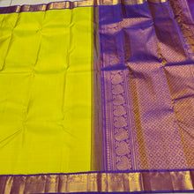Sarasangi -Beautiful Lime Green with Purple Handwoven Pure Jari Korvai Kanjivaram Silk with small borders with elephants yazhis and peacocks woven borders rich pallu and contrast woven beautiful blouse