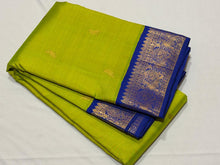 Vaibhogam- Stunning Parrot Green with MS Blue Handwoven Pure Jari Korvai Kanjivaram Silk with Bird buttas woven body with rich borders pallu and contrast woven blouse