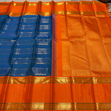 Vaibhogam- Gorgeous Peacock Blue with Orange Handwoven Pure Jari Korvai Kanjivaram Silk with Vairaoosi and Veldhari Striped body with rich doublepet borders with vairaoosi woven middle portions with gorgeous pallu and contrast woven beautiful blouse