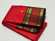Stunning Red with Coffee Brown Vairaoosi with Buttas and Doublepet Meenakari Matte Finish Borders in Jari and Silk threads in a Pure Jari Handwoven Kanjivaram Silk with super gorgeous Kalakshetra kilis woven pallu and a very beautiful contrast blouse.