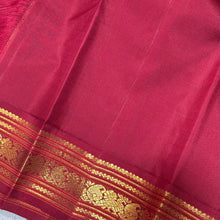 Offwhite with Arakku Red and Emerald Green Ganga Jamuna Korvai Borders with Plus buttas in silk threads woven all over the body with rich arakku pallu and simple green pallu on the other side which can be worn on either sides with a single arakku blouse
