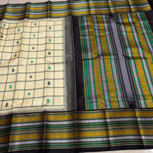 Saraswati- Offwhite with Deep Blackish Brown Handwoven Pure Premium Zariless Korvai Kanjivaram Silk with beautiful neli veldhari checked body with mango and chakram buttas with rich varisaipet borders rich pallu and contrast woven blouse