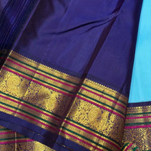 Vaibhogam- Gorgeous Powder Blue with Deep Blue Handwoven Pure Jari Korvai Kanjivaram Silk with gorgeous pattu buttas woven body rich meenakari silk thread and zari woven beautiful borders rich pallu with very intricate and contrast woven beautiful blouse