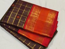 Vaibhogam- Gorgeous Coffee Brown with Red Handwoven Pure Zari Kanijivaram Silk with rich jari checks and meena buttas woven beautiful body with rich borders pallu very intricately woven and contrast woven blouse
