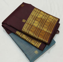 Vaibhogam-Beautiful Pastel Blue with Dark Brown Handwoven Pure Jari Korvai Kanjivaram Silk with Vairaoosi with buttas woven middle body with coffee brown buttas woven lower body and rich broad borders gorgeous pallu and contrast woven blouse