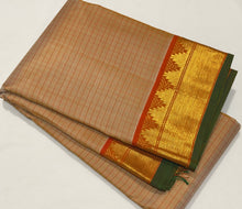 Sahana- Gorgeous Beige with Rustic Orange Handwoven Pure Jari Kanjivaram Silk with Muthukattam checks woven body with beautiful borders with green selvedges rich seer pallu and contrast woven blouse