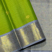 Vaibhogam- Gorgeous Parrot Green with Grey Handwoven Pure 2g Jari Korvai with Vairaoosi woven body with Buttas in a Kanjivaram Silk with rich borders gorgeous pallu and contrast woven grey vairaoosi blouse