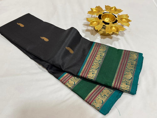 Black with Emerald Green Handwoven Pure Kanjivaram Silk Saree with thilagam buttas woven body doublepet borders elephants woven pallu and contrast blouse