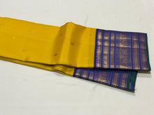 Vaibhogam- Stunning Yellow with Royal Blue Handwoven Pure Zari Korvai Kanjivaram Silk with Buttas Rich Varisaipet Borders gorgeous Meenakari work Pallu and Contrast woven blouse