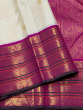 Vaibhogam- Stunning Offwhite with Fuchsia Pink Handwoven Pure Jari Korvai Kanjivaram Silk with beautiful buttas woven body with rich varisaipet borders beautiful pallu and contrast woven blouse with bottle green selvedges
