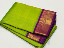 Vaibhogam-Mesmerizing Sneha Green with  purple handwoven pure Jari Korvai Kanjivaram silk with rich borders buttas woven body gorgeous pallu and contrast woven beautiful blouse