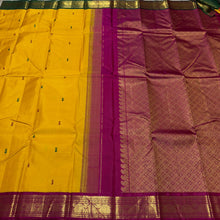 Vaibhogam- Gorgeous Mustard with Magenta and Bottle Green Handwoven Pure Jari Korvai Kanjivaram Silk with thread buttas woven body with beautiful ganga jamuna borders rich pallu and contrast woven blouse
