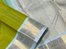 Mesmerizing Tender Leaf Green with Ice Blue combination with Vairaoosi woven gorgeous body with intricately woven borders with elephants and yazhi motifs with gorgeous pallu with yazhis elephants and peacocks woven with beautiful ice blue contrast blouse.