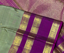 Sarasangi- Stunning Elaichi Green with Deep Magenta Buttas Handwoven Pure 2g Jari Korvai Kanjivaram Silk with beautiful doublepet borders rich woven pallu and contrast woven blouse