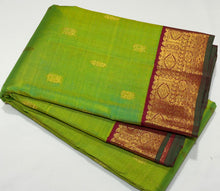 Vaibhogam- Gorgeous Parrot Green with Deep Red Handwoven Pure Jari Korvai Kanjivaram Silk with beautiful thilagam and mayil buttas woven body with beautiful borders rich parrot motifs woven beautiful pallu and contrast woven blouse