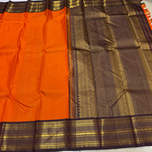 Vaibhogam- Strikingly beautiful Orange with Dark Beetlebut Brown Handwoven Pure2g Jari Korvai Kanjivaram Silk with beautiful Vairaoosi woven rich body with gorgeous varisaipet borders rich pallu and contrast woven beautiful blouse