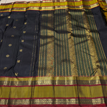 Sahana- Black with Bronze Gold Handwoven Pure Kanjivaram Silk with beautiful buttas woven body with doublepet borders rich zari and thread woven gorgeous pallu and contrast woven blouse