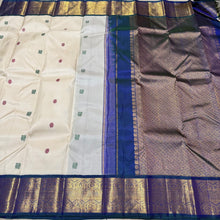 Stunning Handwoven Pure Jari Kai Korvai Kanjivaram Silk Saree in Offwhite body with Sapphire Blue combination with rich pattu buttas woven body gorgeous borders rich pallu and contrast woven blouse