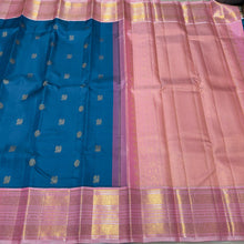 Vaibhogam- Gorgeous Peacock Blue with Soft Pink Handwoven Pure Jari Korvai Kanjivaram Silk  with mayil chakram buttas woven body with rich meenakari borders beautiful and intricately woven pallu and contrast woven blouse