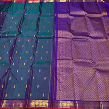 Sahana- Gorgeous Dual tone Lavendarish Blue with Purple Small Borders with orange selvedges with Buttas Handwoven Pure Jari Kanjivaram Silk with rich pallu and contrast woven blouse