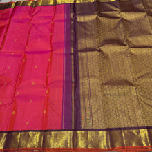 Vaibhogam-Beautiful Double tone Tomato Pink with deep maroonish brown with orange selvedges Handwoven Pure Korvai Kanjivaram Silk with floral buttas woven body beautiful elephants and annapakshis woven gorgeous borders rich pallu and contrast woven blouse