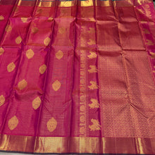 Vaibhogam- Gorgeous Dual tone Burnt Orange Pink with Green Vairaoosi with Buttas Handwoven Pure Jari Kanjivaram Silk with beautiful double Peacock motifs woven body with rich borders with green selvedges beautiful pallu contrast woven green blouse