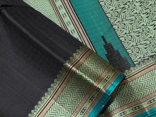 Mindblowing Black with Teal Handwoven Pure Zariless Kanjivaram Silk with intricately woven self Muthukattam body checks rich borders gorgeous pallu and Jacquard blouse beauty