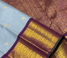Vaibhogam- Mesmerizing Powder Greyish Blue with Deep Purple Handwoven Pure 2g Jari Korvai with Bird Buttas Woven Kanjivaram Silk with rich varisaipet borders with green selvedges gorgeous pallu and contrast woven blouse