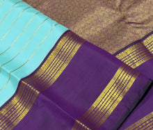 Vaibhogam- Mesmerizing Powder Blue with Deep Purple HandwovenPure jari Korvai Kanjivaram Silk with Jari Veldhari Stripes woven beautiful body with rettapet borders with stunning rich and finely woven pallu and contrast zari striped beautiful blouse
