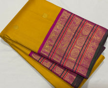 Vaibhogam- Gorgeous Yellow with Rani Pink Handwoven Pure 2g Jari Korvai with Buttas Kanjivaram Silk with varisaipet borders with green selvedges and rich woven pallu and contrast woven blouse