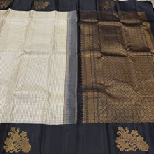 Vaibhogam- Stunning offwhite with black Handwoven Pure Jari Korvai Kanjivaram Silk with beautiful muted checks woven body with gorgeous peacocks woven on either side of the borders with beautiful pallu and contrast black blouse