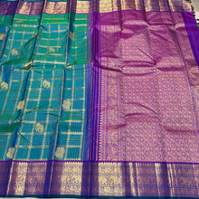 Vaibhogam-Gorgeous Peacock Green with Purple Handwoven Pure Jari Kanjivaram Silk with beautiful Jari checks with elephants and annapakshis woven body with rich borders pallu and contrast jari checked blouse