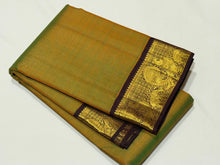Sarasangi- Gorgeous Dual tone Green shot with mustard body with deep brown combination in a handwoven Pure Jari Korvai Kanjivaram Silk with beautiful borders rich pallu and contrast woven blouse