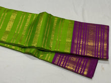 Vaibhogam- Stunning Parrot Green with Purple Handwoven Pure Zari Korvai Kanjivaram Silk with Beautiful Jari Veldhari woven body with rich varisaipet borders gorgeous palli and contrast veldhari stripes woven blouse