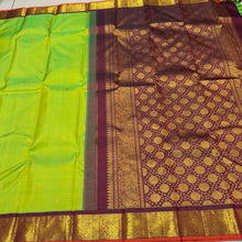 Vaibhogam-Gorgeous Sneha Green with Deep Maroonish Brown Handwoven Pure Jari Korvai Kanjivaram Silk with beautiful kolam buttas woven body with rich borders with orange selvedes gorgeous pallu with polka dots woven and contrast woven blouse