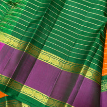 Vaibhogam- Gorgeous Orange with Emerald Green Handwoven Pure Jari Korvai Kanjivaram Silk with beautiful jari veldhari stripes and silk thread striped body with beautiful doublepet borders with rich pallu and contrast woven blouse
