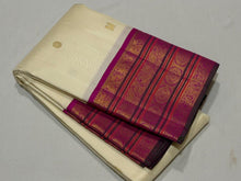 Vaibhogam- Stunning Offwhite with Fuchsia Pink Handwoven Pure Jari Korvai Kanjivaram Silk with beautiful buttas woven body with rich varisaipet borders beautiful pallu and contrast woven blouse with bottle green selvedges
