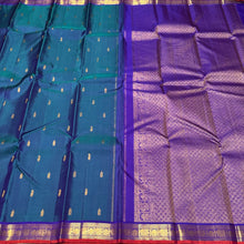 Sahana- Gorgeous Peacock Blue with Violet Combo in a handwoven pure jari Buttas Kanjivaram Silk with small borders orange jamudu with rich pallu and contrast woven blouse